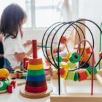 Young girl playing with educational toys